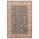 Vintage ornate area rug with detailed floral and geometric pattern.