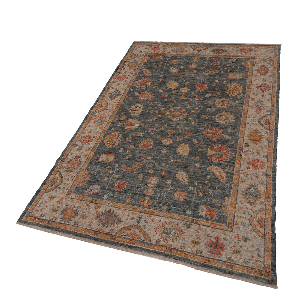 Vintage rectangular area rug with ornamental designs on solid background.