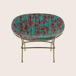 Stylish chair with floral upholstery and gold metal frame design.