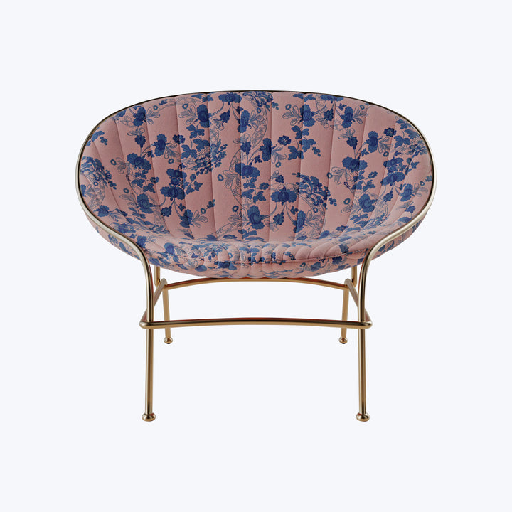 Stylish chair with floral upholstery and gold frame, modern design.