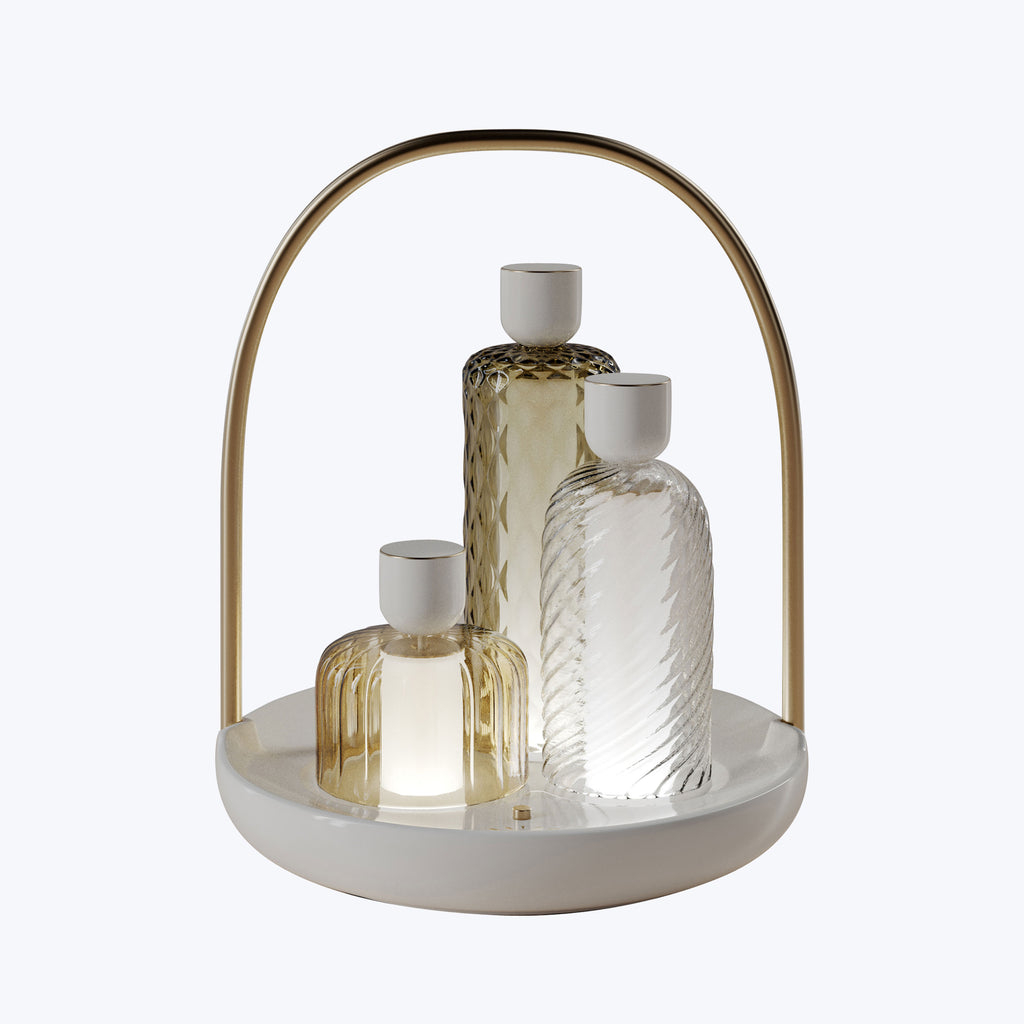 Modern luxury decor set with geometric glass bottles on tray.