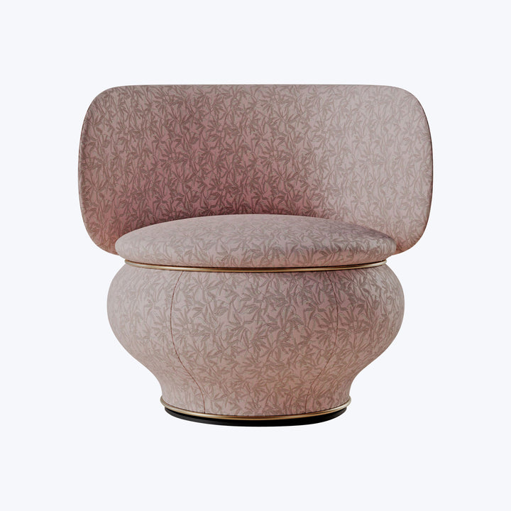Modern armchair with curved backrest, leaf motif upholstery, and comfort.