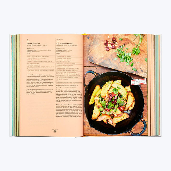 Recipe for potato wedges with herbs in open cookbook spread