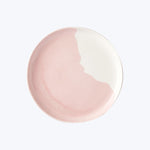 Close up of pale pink cosmetic product with glossy finish