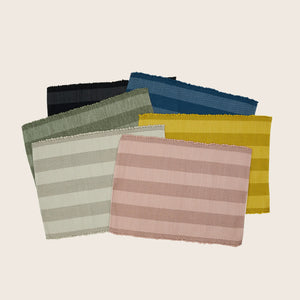Beige striped fabric with textured weave and scalloped edge detail. - hover