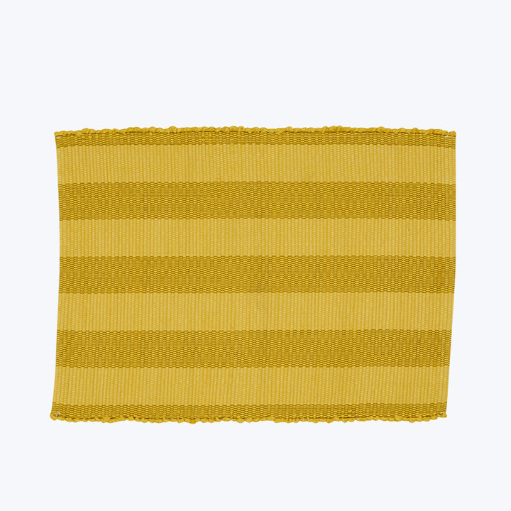 Yellow striped woven textile with scalloped edge, likely a placemat.