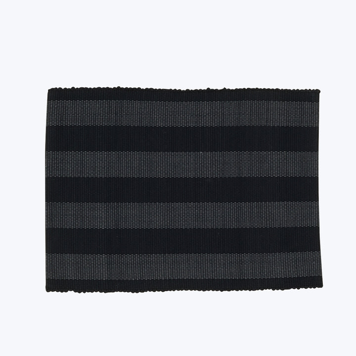 Rectangular fabric sample with alternating black and patterned stripes.