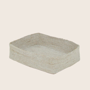 Woven beige basket with square base and raised edges texture.