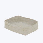 Woven beige basket with square base and raised edges texture.