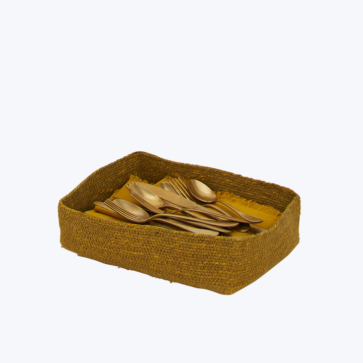 Rectangular woven basket with gold flatware on white background catalog