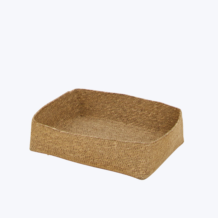 Rectangular woven basket made from natural fiber in light brown.