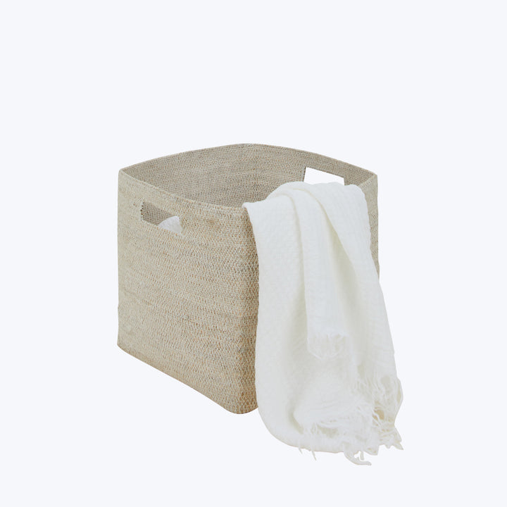Rectangular woven basket with textured finish and cut-out handle design.