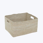Minimalist beige woven fabric storage basket with cut-out handles.