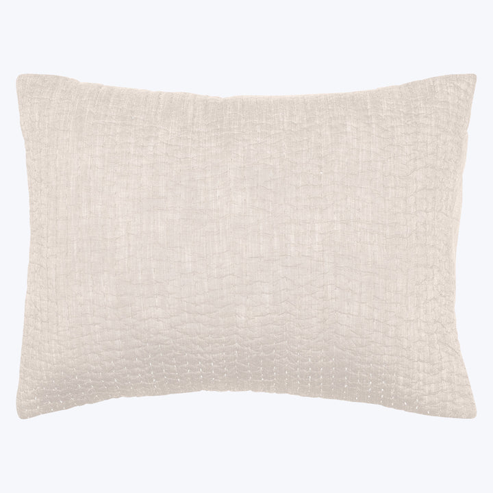 Neutral rectangular throw pillow with textured fabric in light beige.