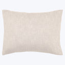 Neutral rectangular throw pillow with textured fabric in light beige.