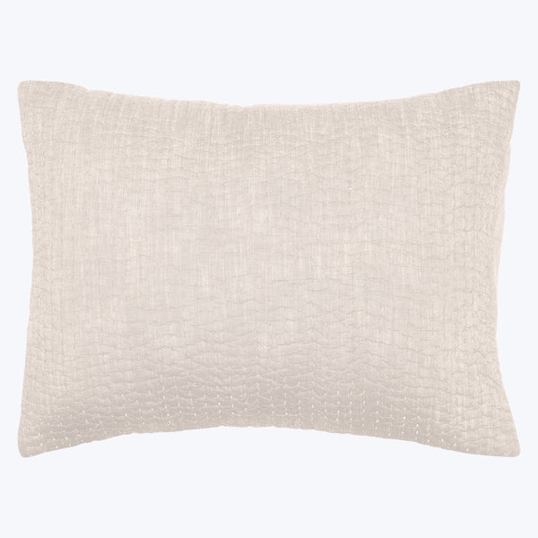 Neutral rectangular throw pillow with textured fabric in light beige.