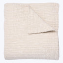 Large cream blanket with plush ribbed texture and consistent color