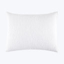 White textured pillow with raised ripple pattern on isolated background.