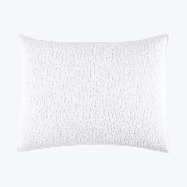 White textured pillow with raised ripple pattern on isolated background.