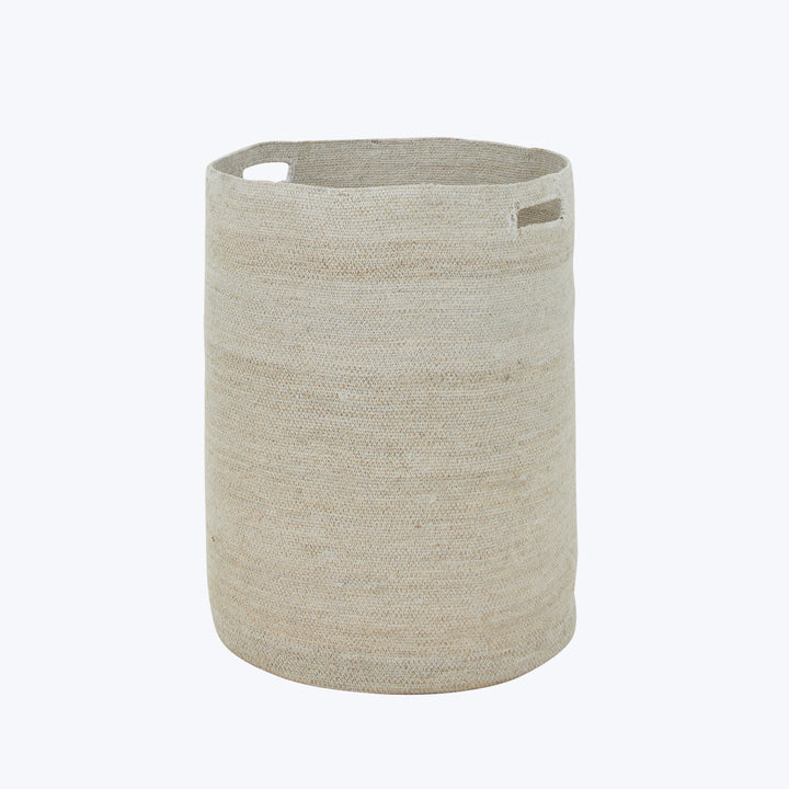 Neutral beige cylindrical fabric storage basket with cut-out handles.
