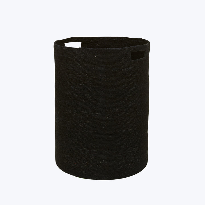 Black woven fabric storage basket with handle against light background.