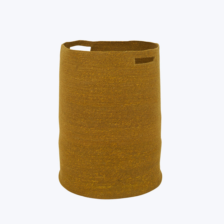 Mustard-yellow woven fabric basket with cut-out handles and label tag.