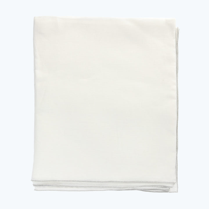Neatly folded white cloth on light background, clean presentation concept.