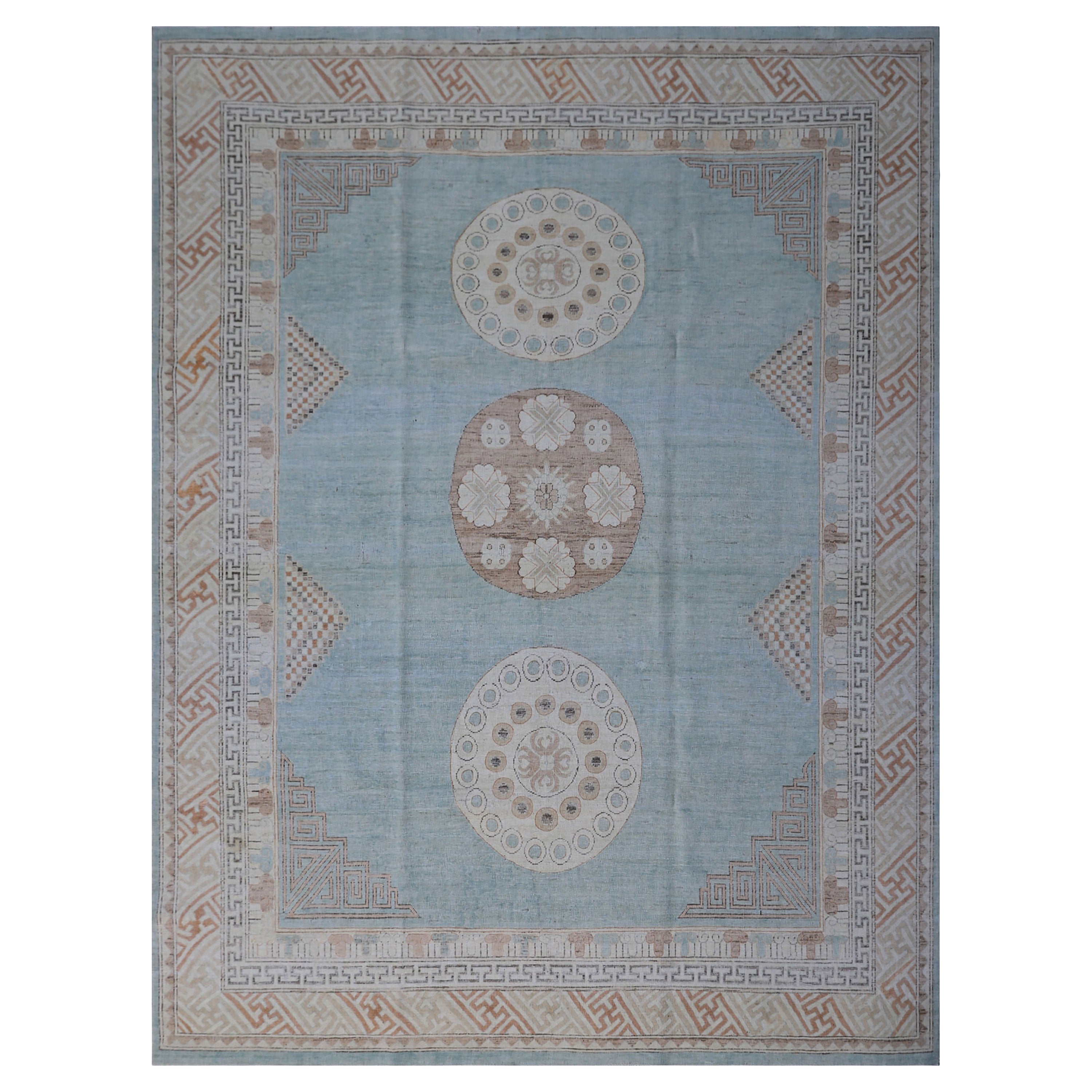 Traditional decorative rug with geometric and floral motif design in pale blue and beige