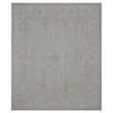 Elegant rectangular area rug with floral design in muted colors.