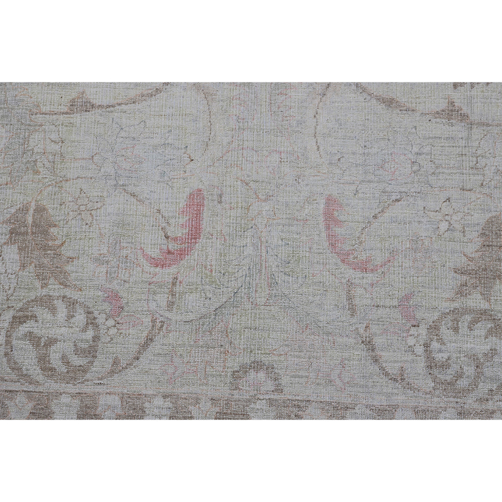 Vintage-inspired distressed fabric with muted floral motifs, beige and taupe.