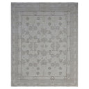 Elegant monochromatic area rug with floral and geometric medallion pattern.