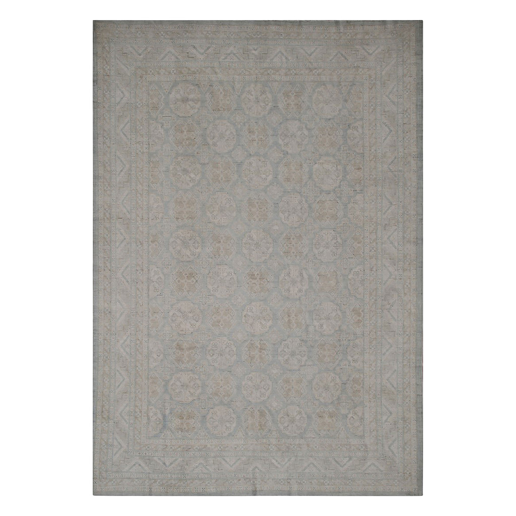 Rectangular area rug with elegant geometric and floral pattern design.