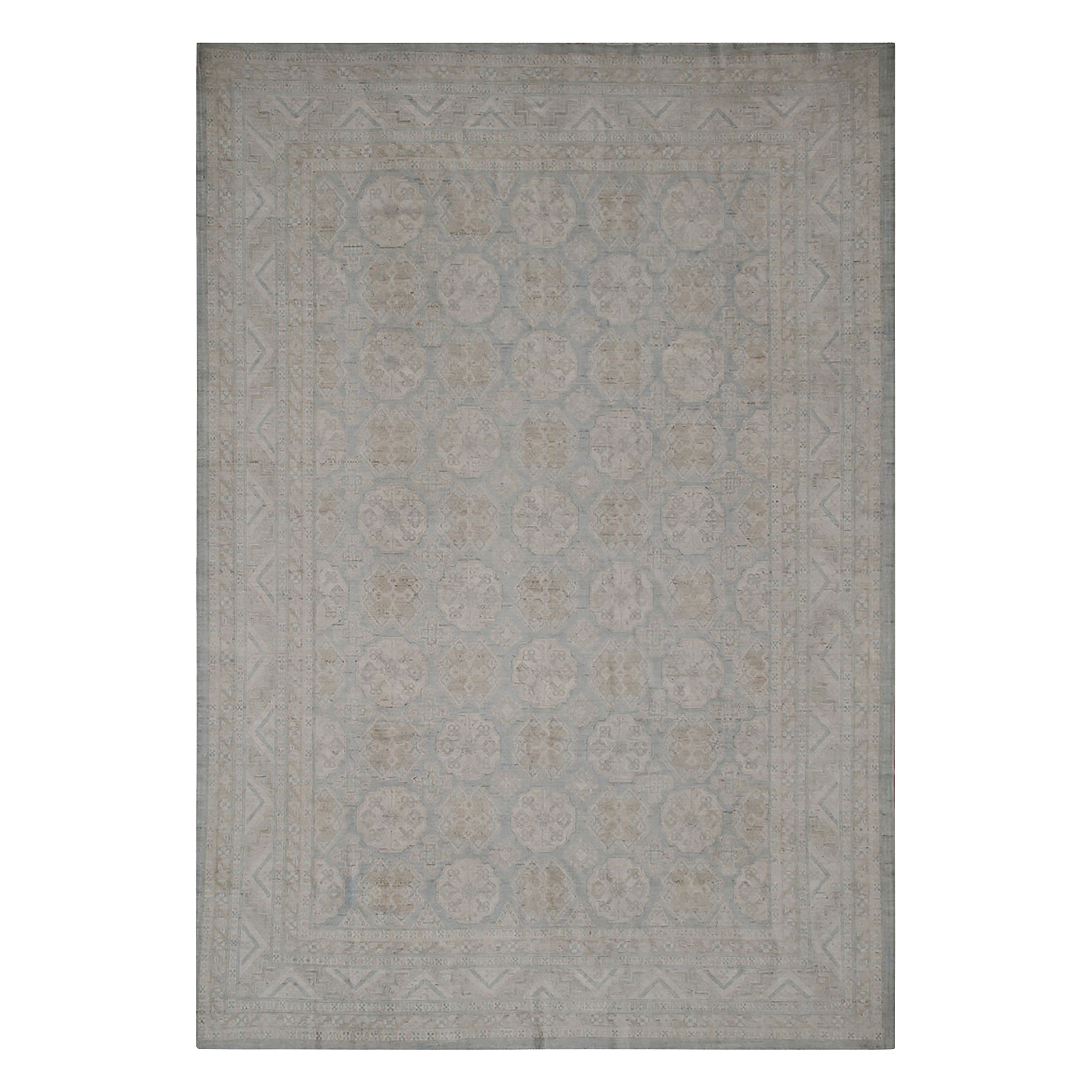 Rectangular area rug with elegant geometric and floral pattern design.