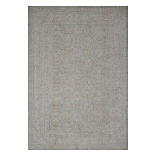 Rectangular area rug with elegant geometric and floral pattern design.