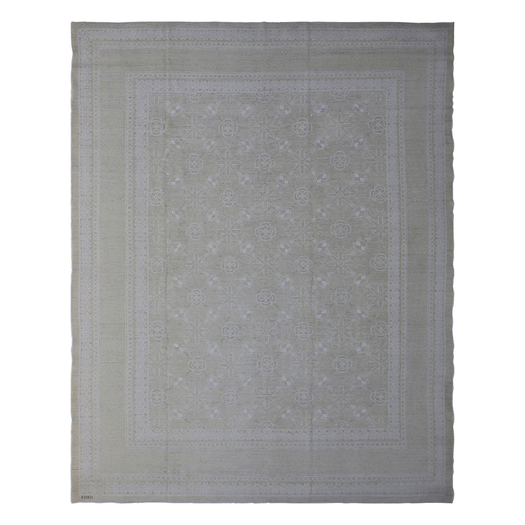 Intricately designed rug with symmetrical pattern and floral motifs