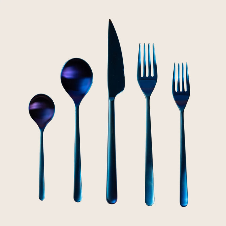 Set of five metallic cutlery pieces in blue and purple
