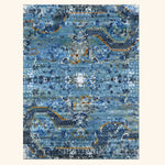 Vintage rectangular carpet with ornate blue design and aged look.