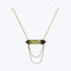 Elegant minimalist necklace with large transparent gemstone in dark setting.