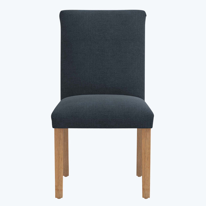 Modern dining chair with dark gray fabric upholstery and wood legs.