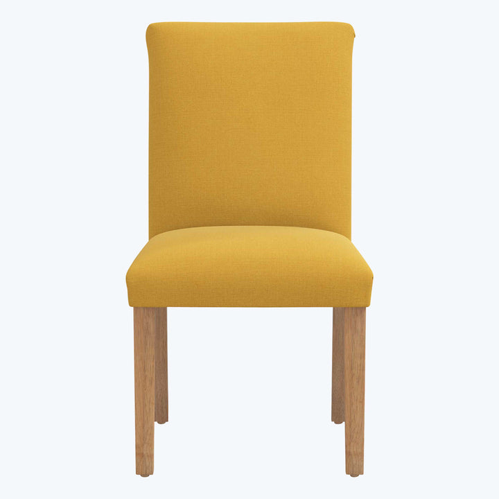 Modern dining chair with vibrant yellow upholstery and wooden legs.