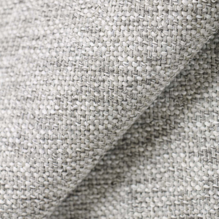 Close-up of textured fabric with grid pattern in neutral tones.