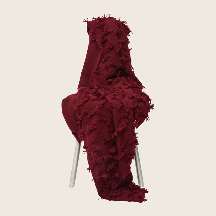 Unique chair with textured red fabric and metallic legs design