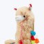 Festive plush llama toy with colorful decorations and playful design.