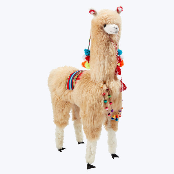 Cute llama plush toy with colorful accessories on white background.