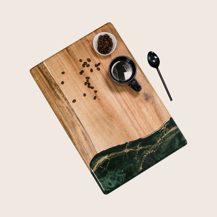 Stylish wooden tray with marble inlay, coffee mug, beans arrangement