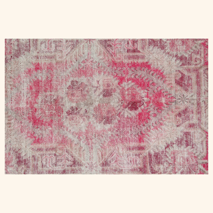 Vintage distressed rug with faded red, pink, beige floral design. Rustic charm.