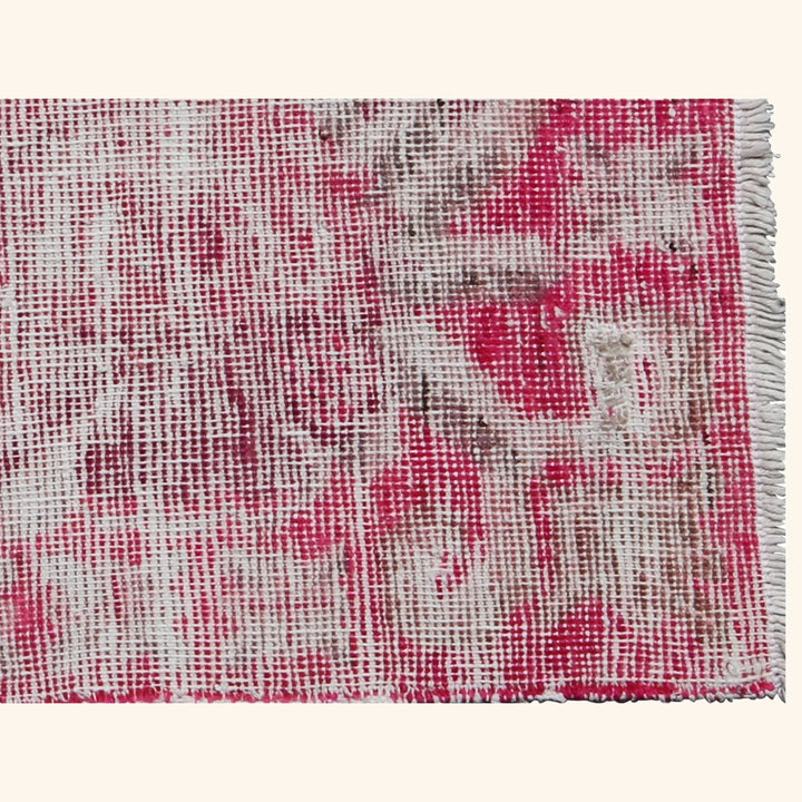 Close-up of multicolored woven fabric with frayed edges and texture