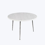 Sleek, modern round table with metal legs, versatile for any space.