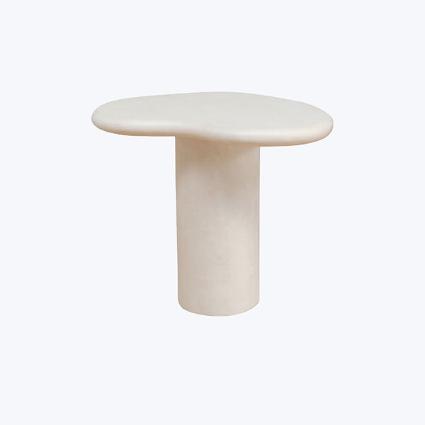 Minimalist modern table with cylindrical base and round stone top.