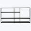 Modern black metal shelving unit with staggered design, minimalist style